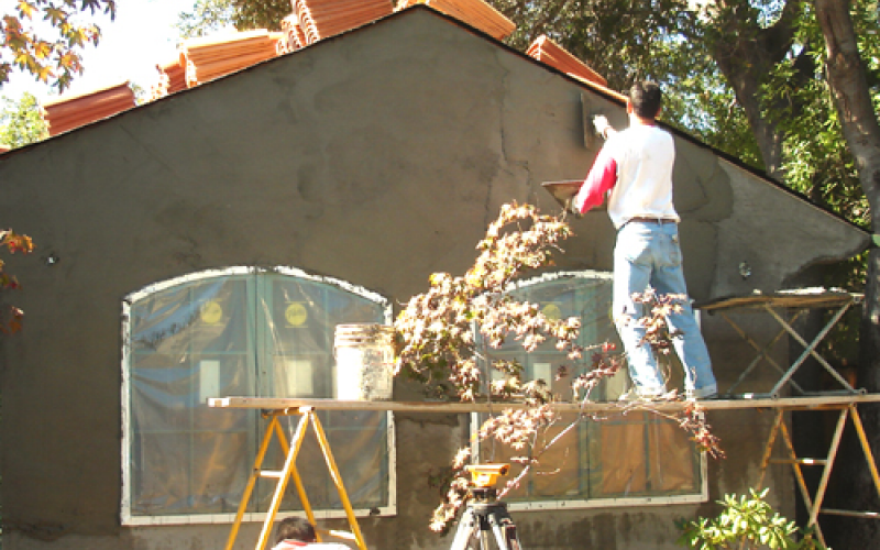 Putting plaster on wall