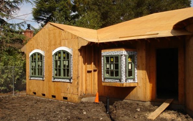 Front of home with windows during remodel
