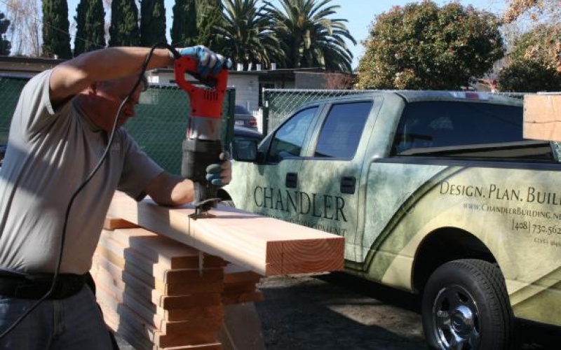 Sawing a beam down to size on site